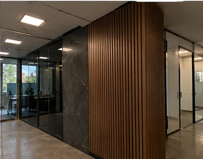 Commercial interior with a wood-slat feature wall and a stone-effect panel
